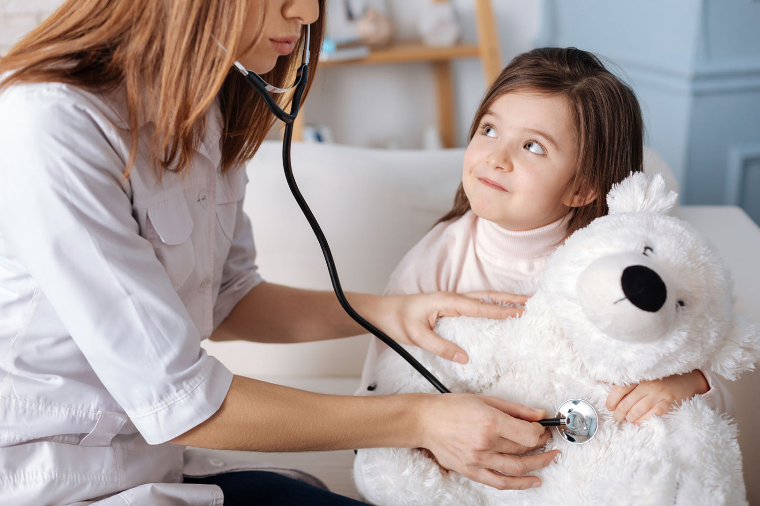 Nurse with Child in Doctor's office