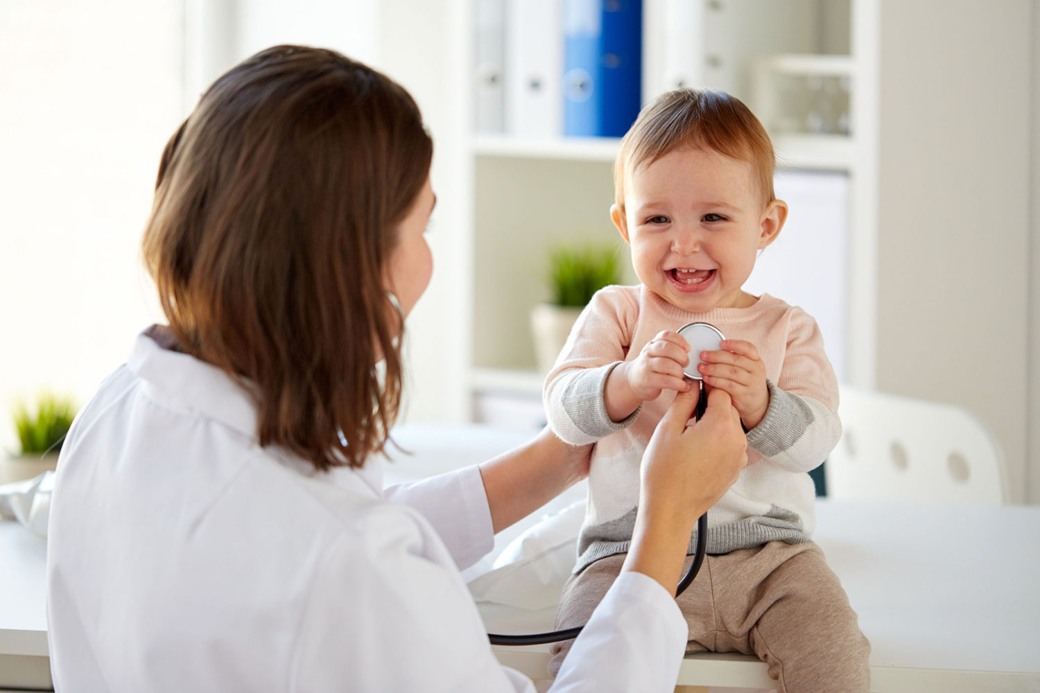 Nurse with Child in Doctor's office