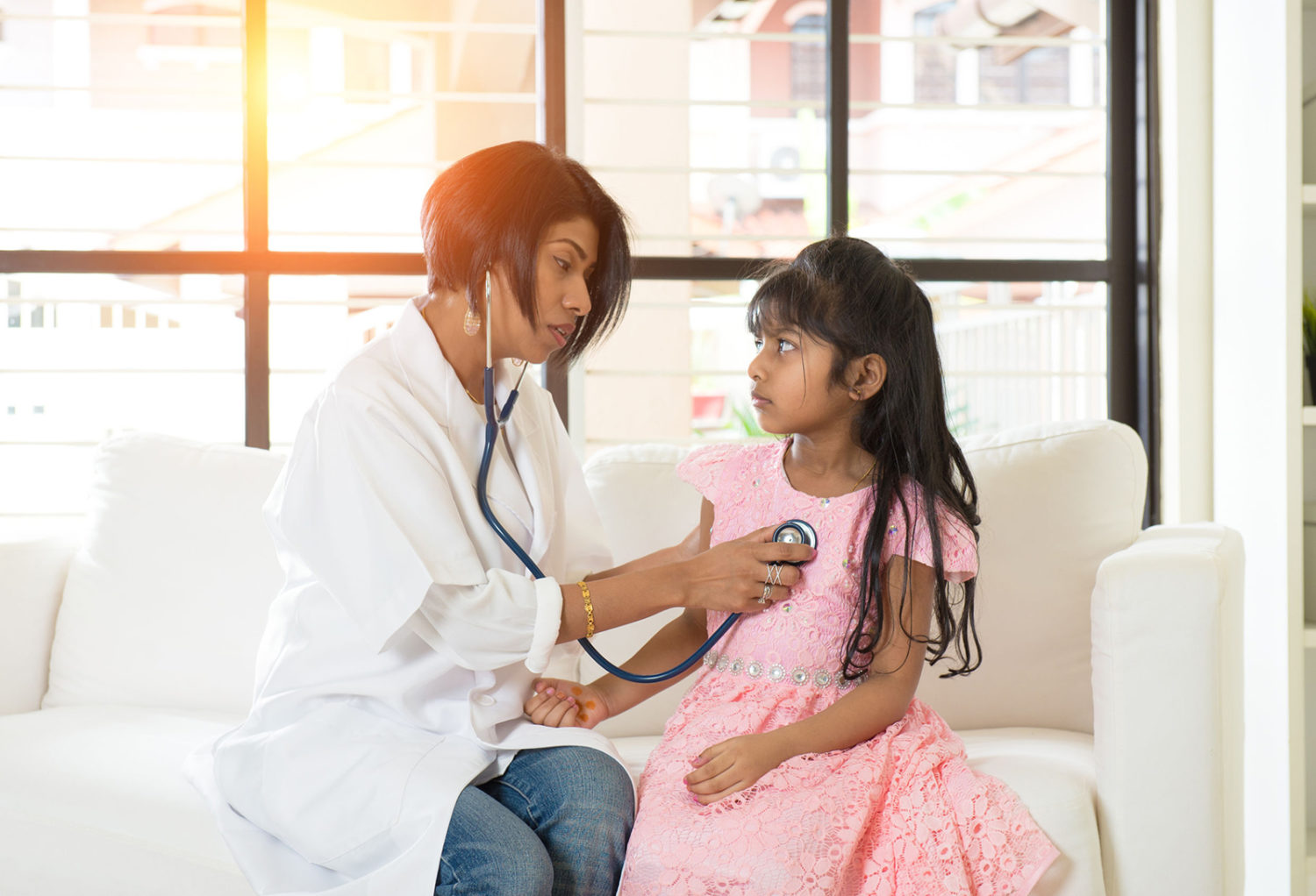 Nurse with Child in Doctor's office